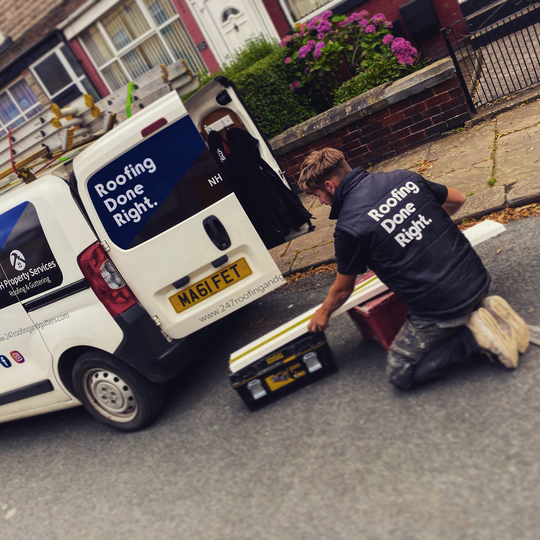 NH Property Services team member beside the branded roofing van