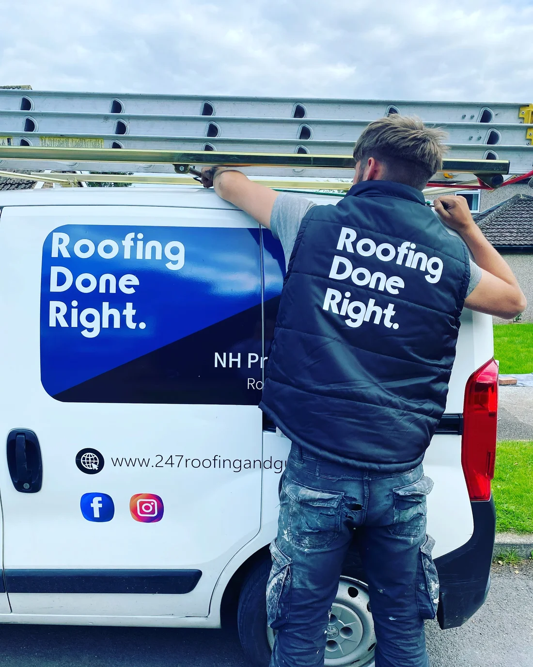 A team member loading ladders onto the NH Property Services van
